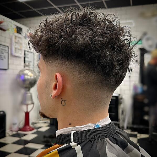 Blonde shaggy mullet with undercut