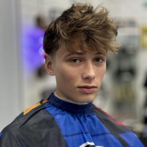 Curly top with mid fade, back view