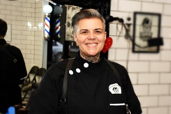 Tina in the shop, smiling