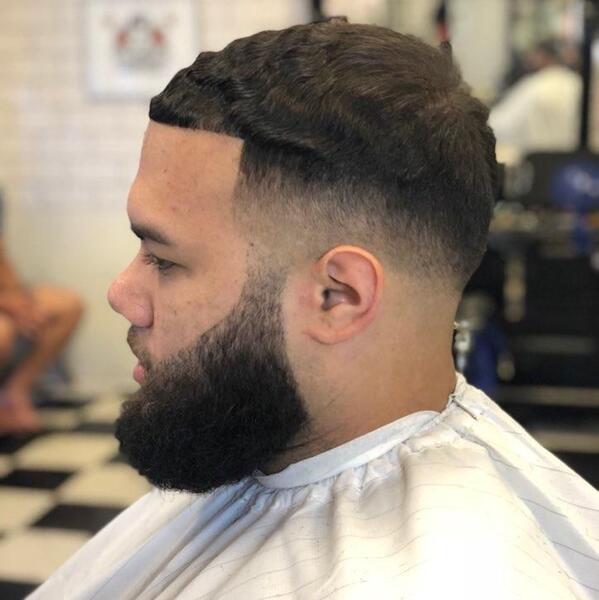 Low fade with wave pattern and beard