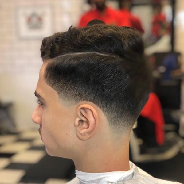 Textured wave pompadour with skin fade